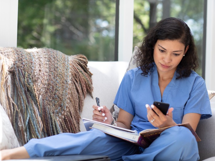 woman sitting with list