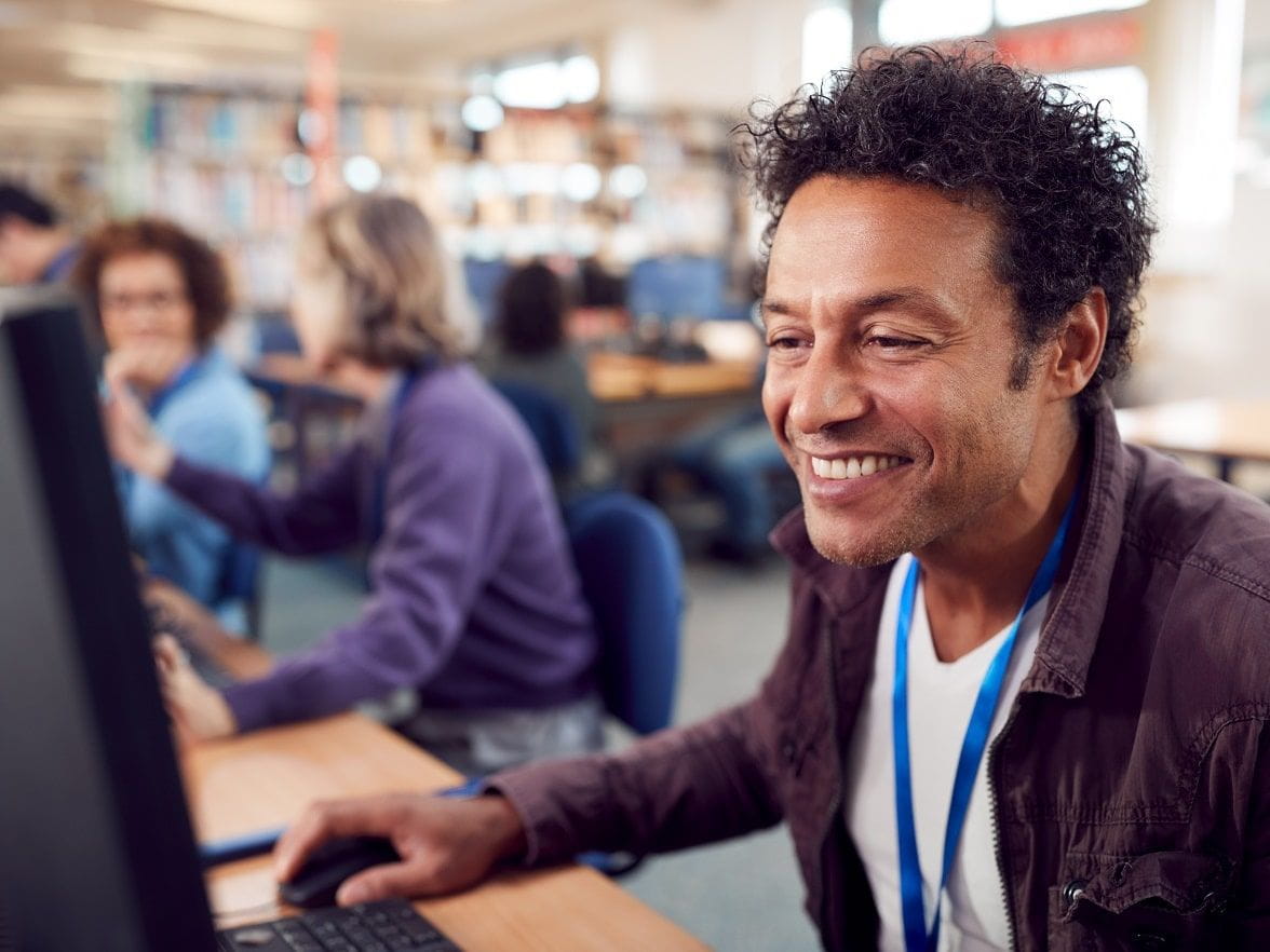 man in office working at computer