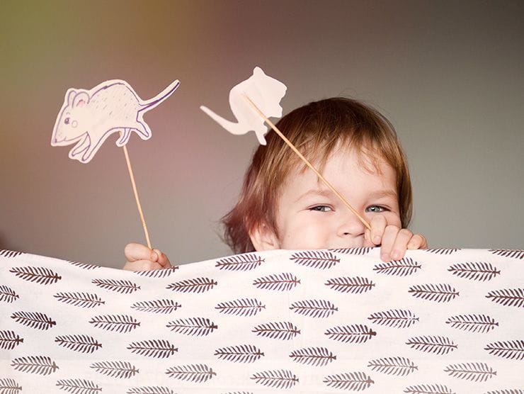 Toddler playing with stick animals at day care 