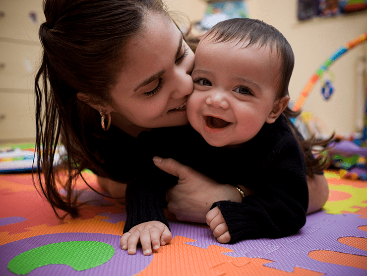 Teacher and baby playing