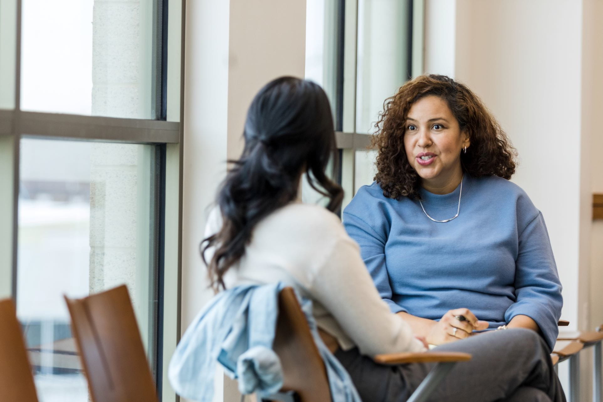 woman networking with another person