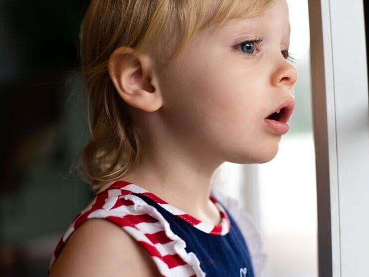 Small child looking out the window