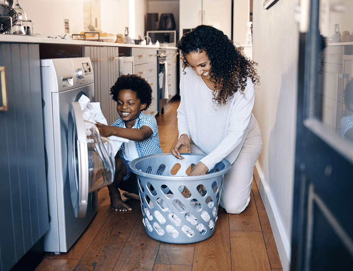 Mother and son doing laundry