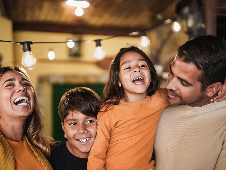 Family of four celebrating