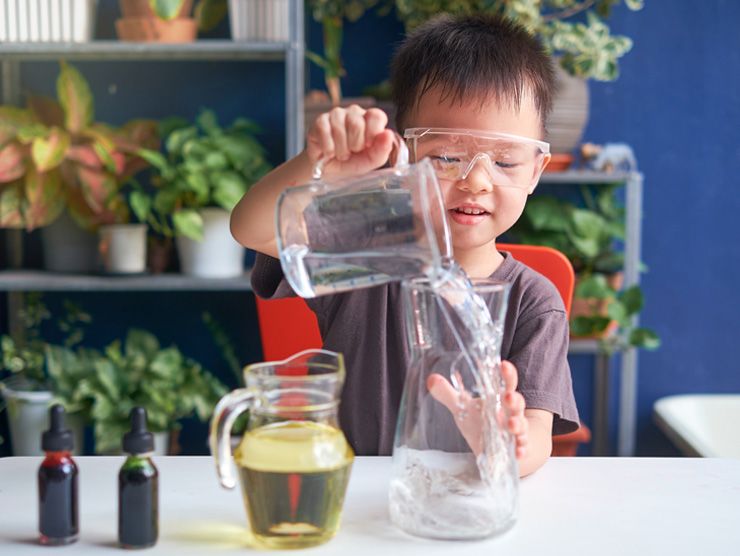 Boy pouring water