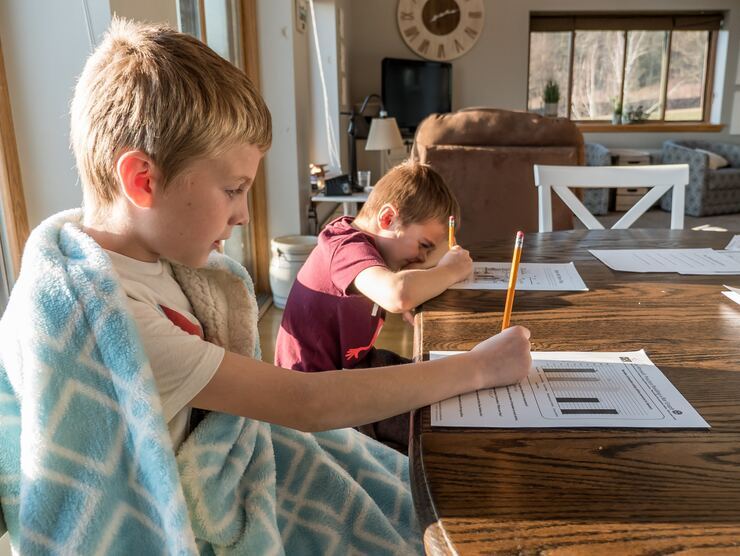 School aged boys doing homework