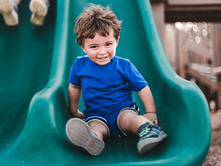 Toddler playing outside at child care center