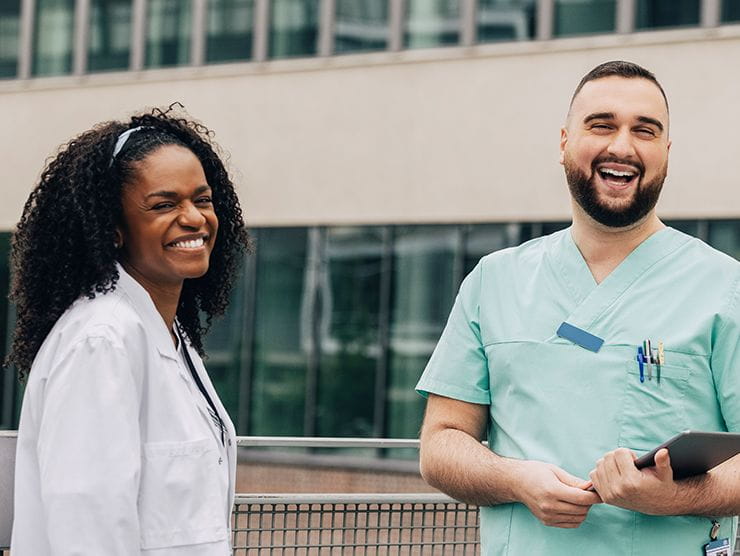Two healthcare workers smiling